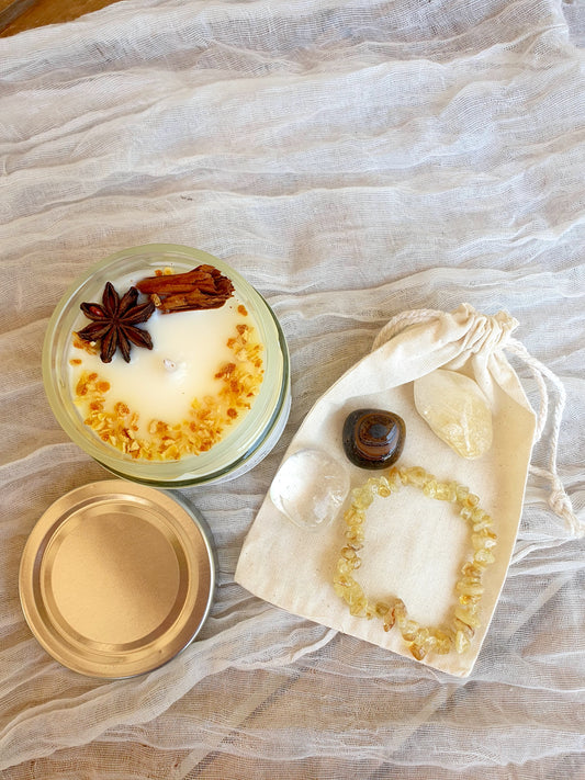 Pack Destellos de Invierno con vela White Magic, minerales energéticos y pulsera de citrino para claridad, fuerza interior y luz emocional.