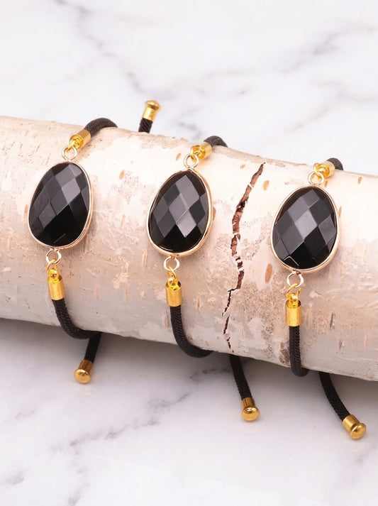Pulsera de obsidiana negra facetada en cordón negro ajustable, joya de protección y fuerza energética. 1